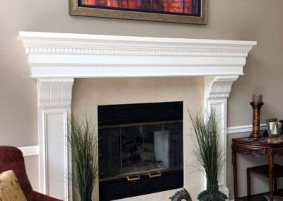 A custom designed and built fireplace inspired from a picture in a magazine replaced an old worn out fireplace surround.