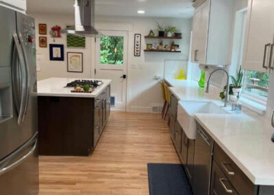 A wall was removed from this old galley style kitchen and an island installed which creates a larger more functional space for this busy family of six.